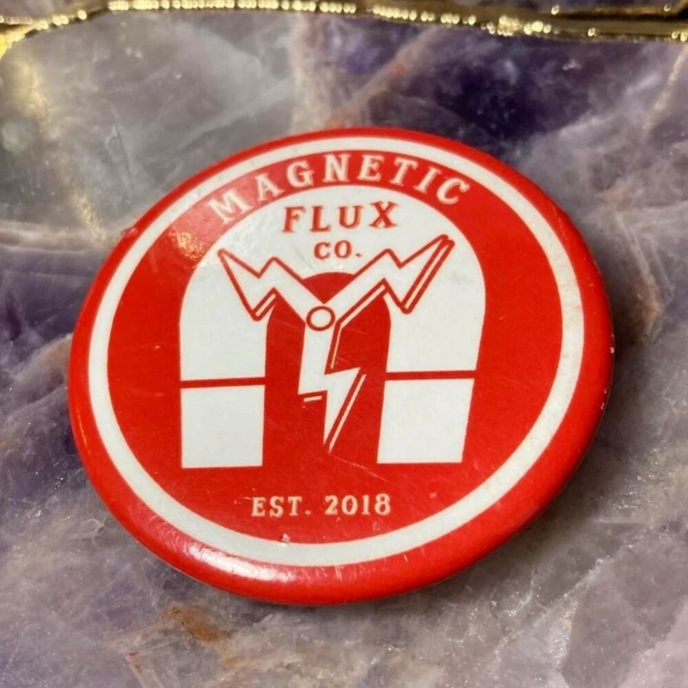 Magnetic Flux Co. red & white button with white lightning bolt graphic